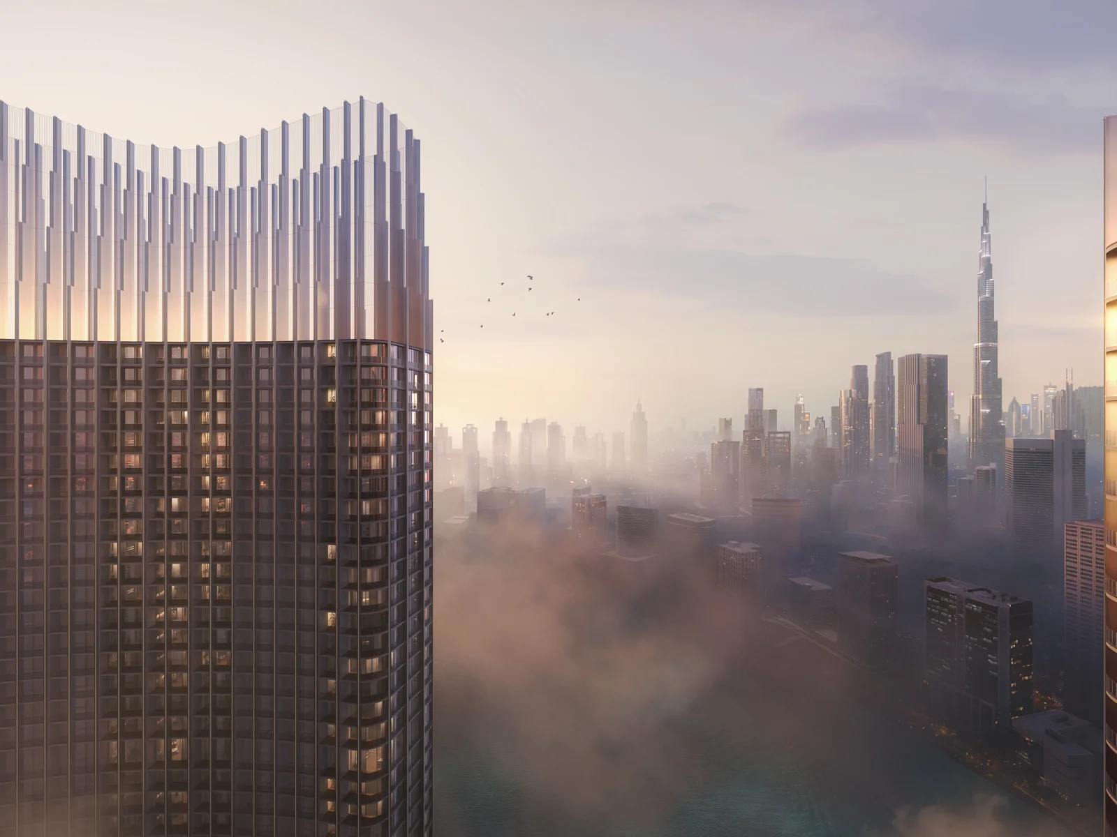 Binghatti Skyrise, Turmkronen über Nebel mit Burj Khalifa in der Ferne